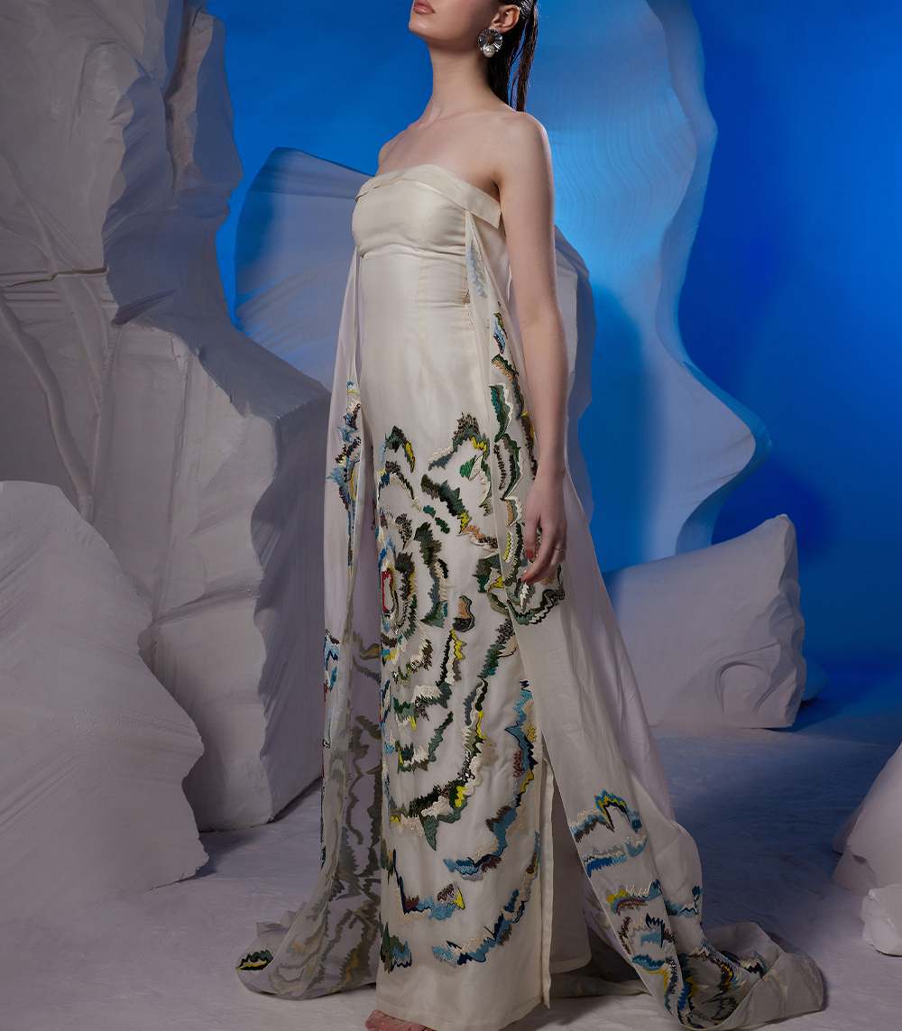 VIBRANT EMBROIDERED STRAPLESS IVORY GOWN WITH CAPE